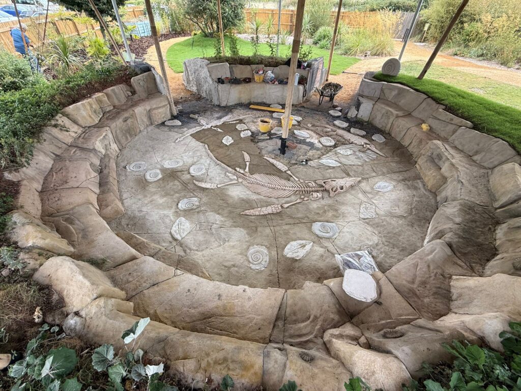Below the sand of the new jurassic dig at jurassic discovery
